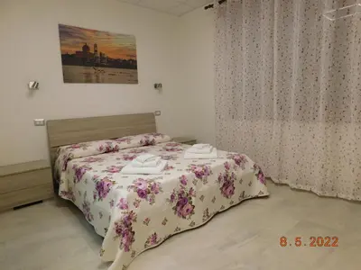 Letto o letti in una camera di B&B DiVino