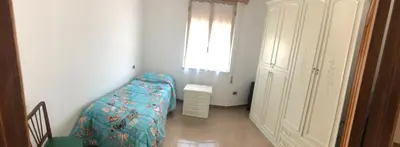 Letto o letti in una camera di La Corbula - Casa Vacanze - Q5992