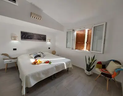 Letto o letti in una camera di villa Dammar