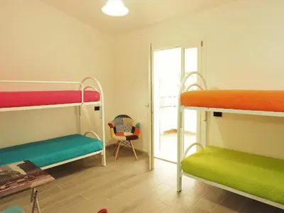 Letto o letti in una camera di villa Dammar
