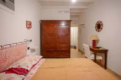 Letto o letti in una camera di Il Cagliarese B&B