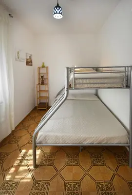 Letto o letti in una camera di Mario & Nina - Portopino House