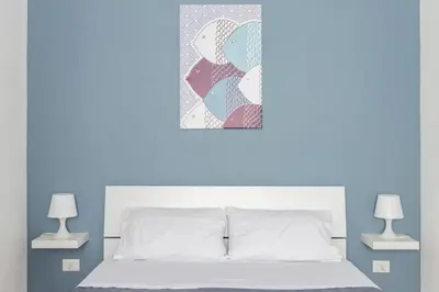 Letto o letti in una camera di Bianca - Marlù House -