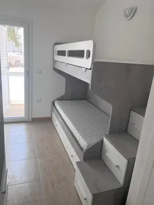 Letto o letti in una camera di Residence Le Maree