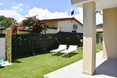 Giardino di Bilocale Mimosa 80 m dalla spiaggia