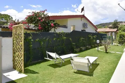 Giardino di Bilocale Mimosa 80 m dalla spiaggia
