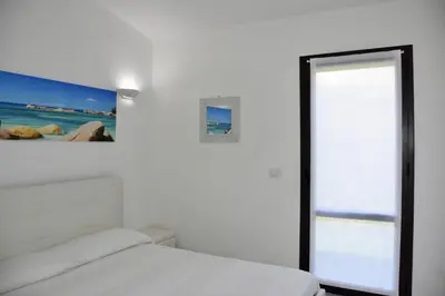 Letto o letti in una camera di Bilocale Mimosa 80 m dalla spiaggia