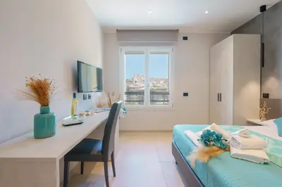 Letto o letti in una camera di Welcome Cagliari
