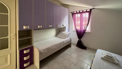 Letto o letti in una camera di Casa del Minatore 1 - Gonnesa