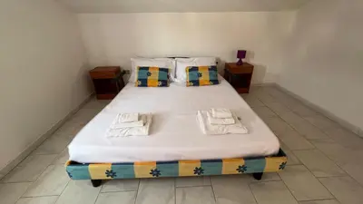 Letto o letti in una camera di Casa del Minatore 1 - Gonnesa