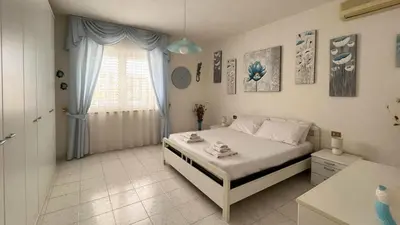 Letto o letti in una camera di Casa del Minatore 2 - Gonnesa