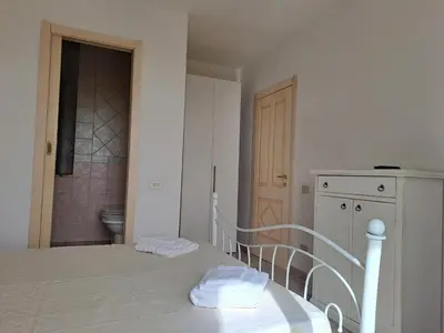 Letto o letti in una camera di ALICE B&B
