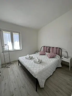Letto o letti in una camera di Domus Virginia