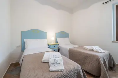 Letto o letti in una camera di Villa Giorgia, graziosa villa a due passi dal mare
