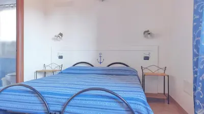 Letto o letti in una camera di Agriturismo Costa Verde