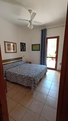 Letto o letti in una camera di Villasimius casa vacanze