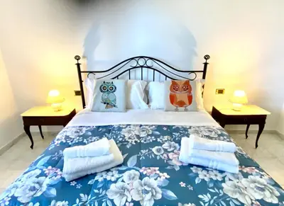 Letto o letti in una camera di AragoniteAzzurra Casa Vacanza