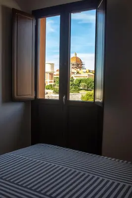 Letto o letti in una camera di WEST SARDINIA APARTMENT 3