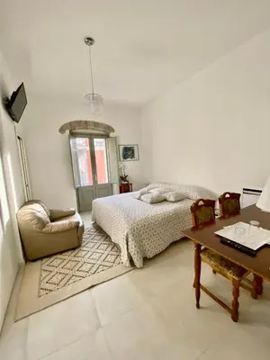 Letto o letti in una camera di Casa Opera