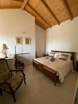 Letto o letti in una camera di Casa Opera