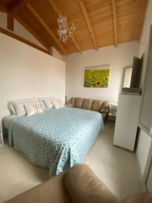 Letto o letti in una camera di Casa Opera