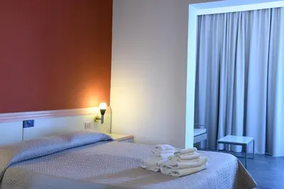 Letto o letti in una camera di Hotel Orri