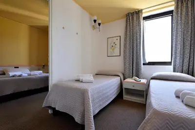 Letto o letti in una camera di Hotel Orri