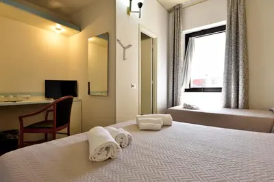 Letto o letti in una camera di Hotel Orri