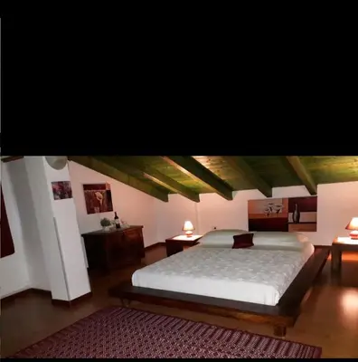 Letto o letti in una camera di La fontanella