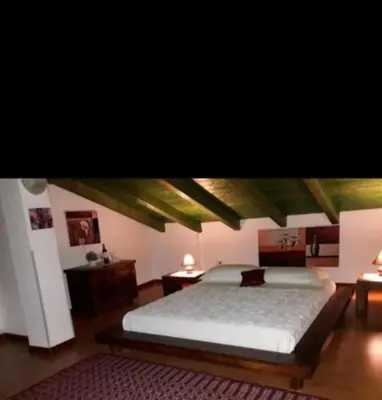 Letto o letti in una camera di La fontanella