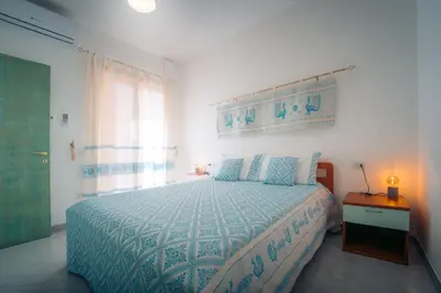 Letto o letti in una camera di Dimora Pintau in residence con piscina privata