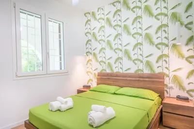 Letto o letti in una camera di Villa Acquario Elegance - 200 mt dalla spiaggia