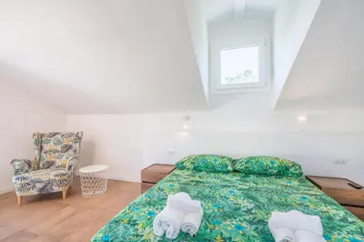 Letto o letti in una camera di Villa Acquario Elegance - 200 mt dalla spiaggia