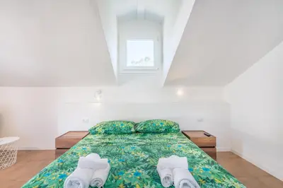 Letto o letti in una camera di Villa Acquario Elegance - 200 mt dalla spiaggia