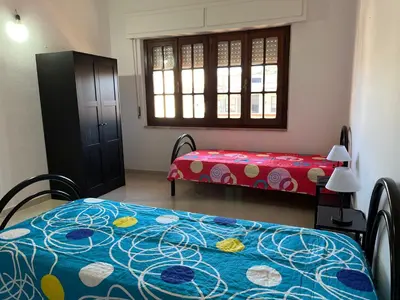 Letto o letti in una camera di Casa Vacanze Costa Ovest