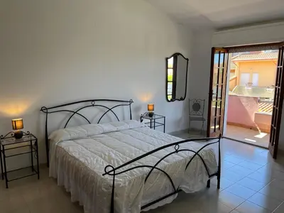Letto o letti in una camera di Casa Vacanze Costa Ovest