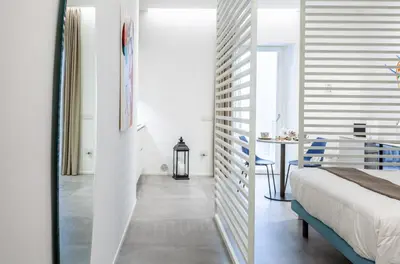 Letto o letti in una camera di corte23 suite