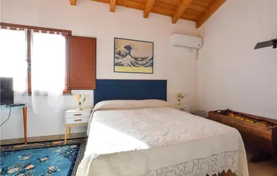 Letto o letti in una camera di Amazing Apartment In Riola Sardo