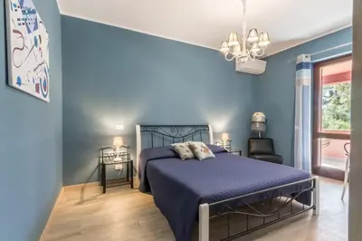 Letto o letti in una camera di Villa con grande giardino ad 800 mt dal mare