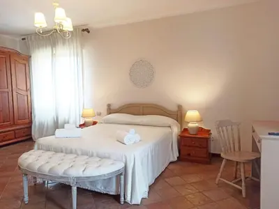 Letto o letti in una camera di Casa Azzurra