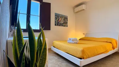 Letto o letti in una camera di B&b Domo La Laguna