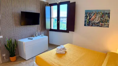 Letto o letti in una camera di B&b Domo La Laguna