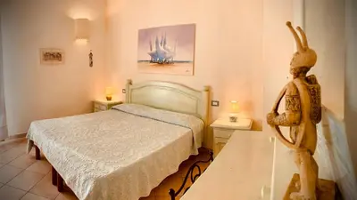 Letto o letti in una camera di B&b Domo La Laguna