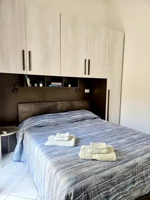 Letto o letti in una camera di Easy Stay Cagliari Casetta 144A comfort e relax