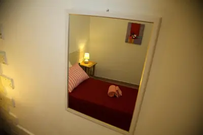 Letto o letti in una camera di Biddanòa Affittacamere