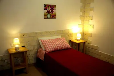 Letto o letti in una camera di Biddanòa Affittacamere