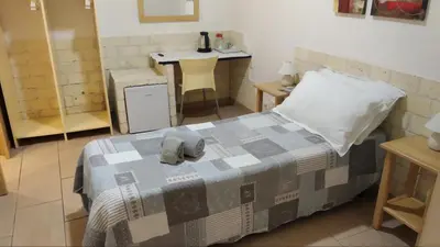 Letto o letti in una camera di Biddanòa Affittacamere