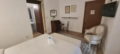 Letto o letti in una camera di Beni Benius