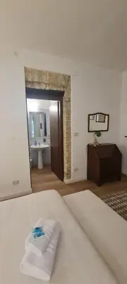 Letto o letti in una camera di Beni Benius