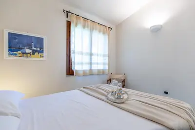 Letto o letti in una camera di Patio Relax - 200m from beach - Villasimius